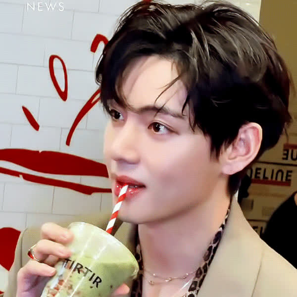 Signature photo of V (BTS) capturing their charm