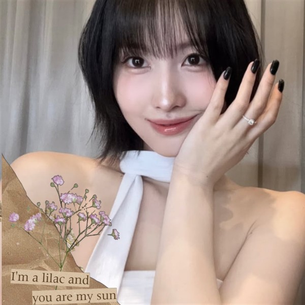 Signature photo of Momo (TWICE) capturing their charm