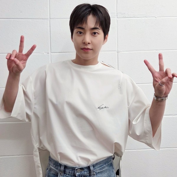Signature photo of Xiumin (EXO) capturing their charm