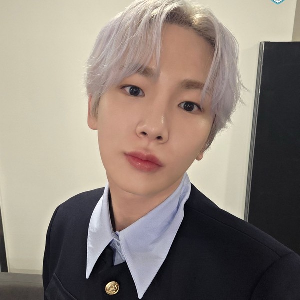 Signature photo of Key (SHINee) capturing their charm
