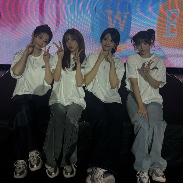 Signature photo of QWER capturing their charm